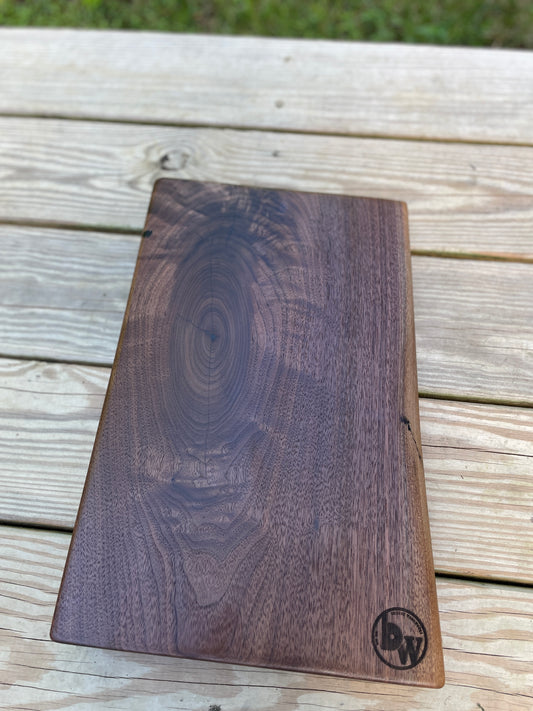 Walnut charcuterie board with knot